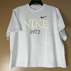 Women’s size M NIKE Tee. Color: Birch Heather gray.